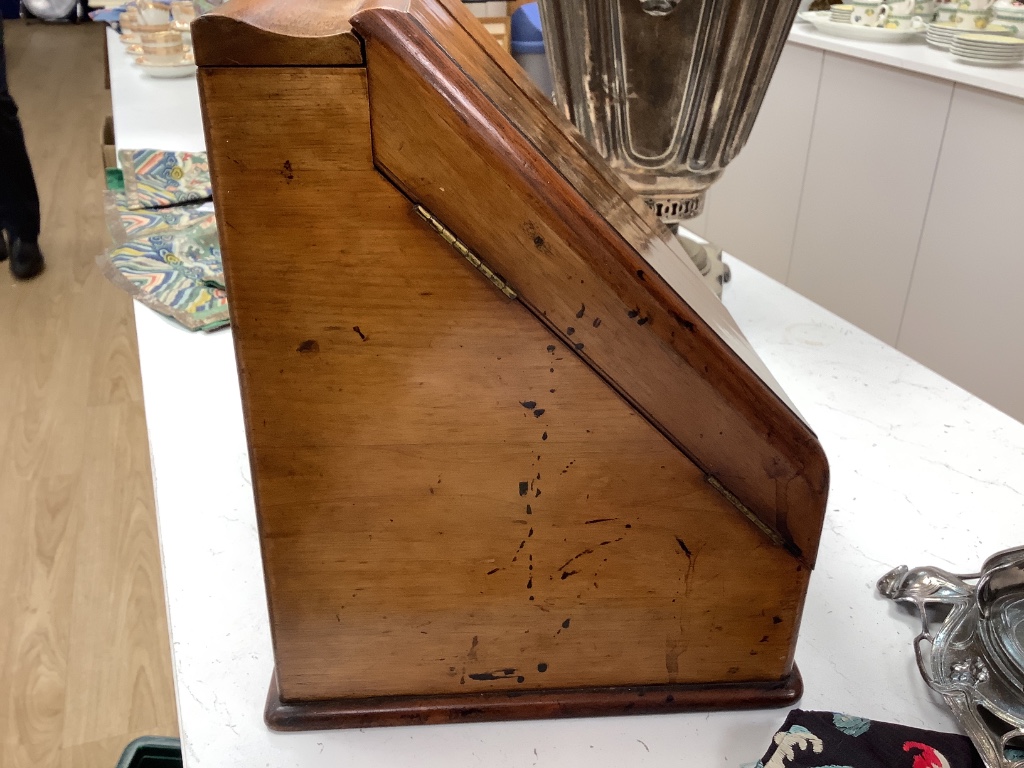 A Victorian walnut stationery box with fitted interior, height 31cm